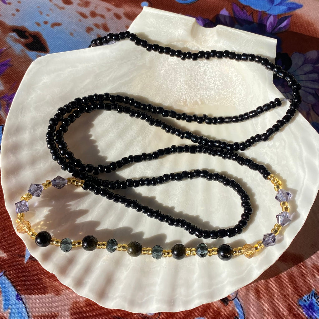 black waist beads with gold, purple and black glass beads, black obsidian and gold sheen obsidian.