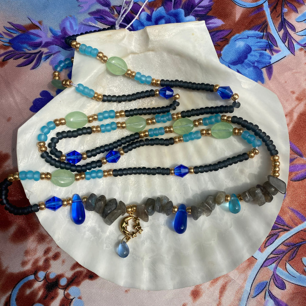 black and gold waist beads with blue and jade green glass beads, labradorite crystal and moon star gold charm.