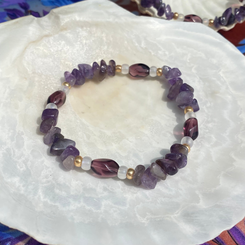 purple amethyst crystal bracelet made with purple glass beads, transparent matt and gold seed beads.